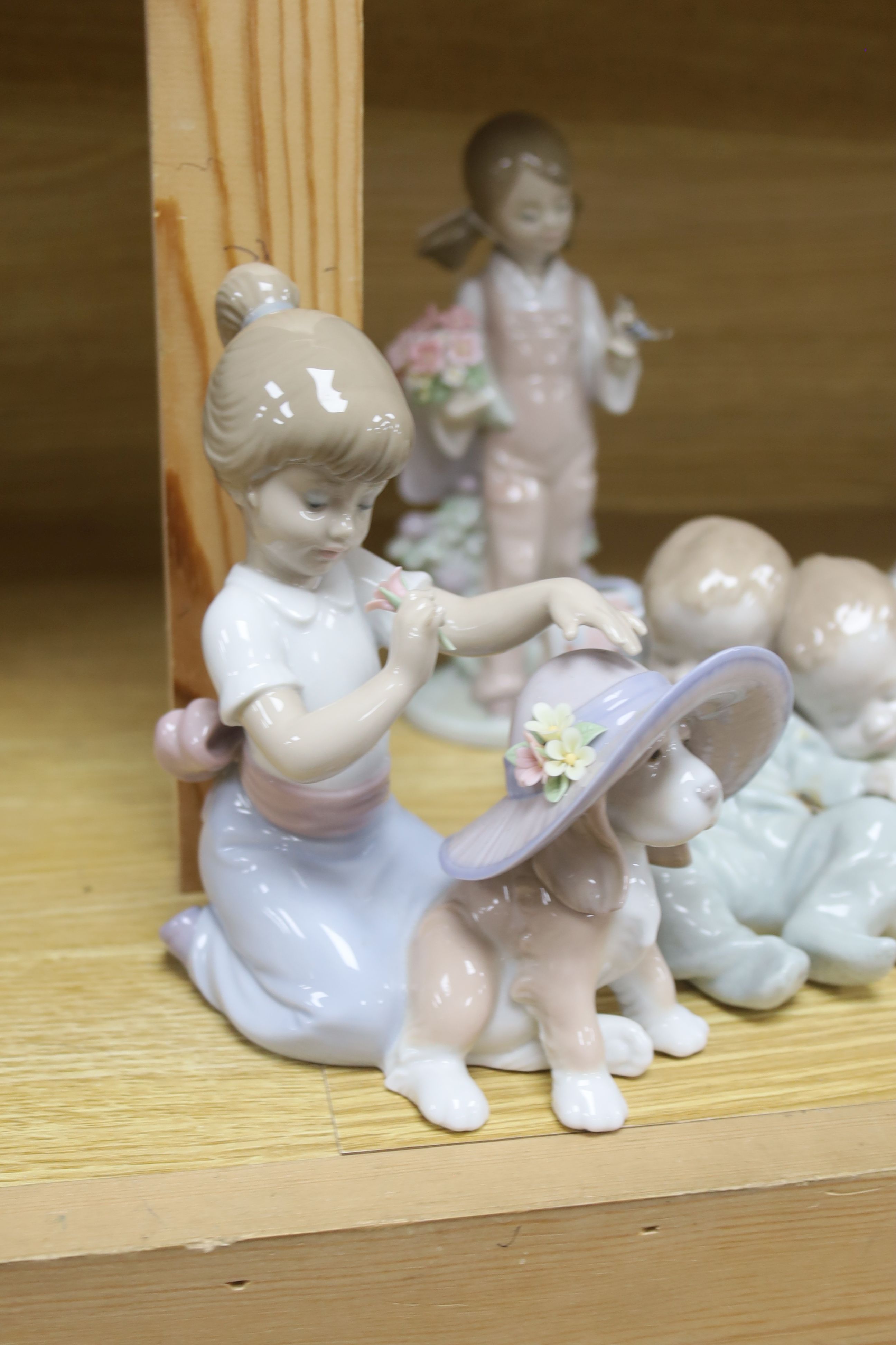 Five Lladro figures, comprising 'An Elegant Touch', 'Spring', 'Little Dreamers', 'Bearly Love' and a goose